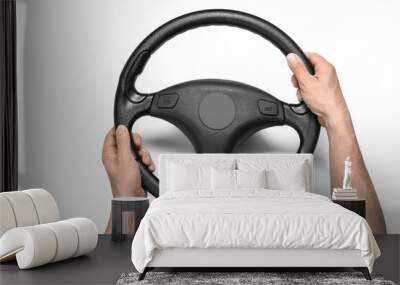 Man holding modern steering wheel on white background Wall mural