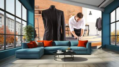 Mannequin with half-finished male suit in tailor's workshop Wall mural