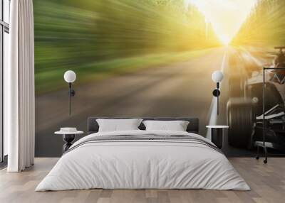 Modern fast racing car on road Wall mural