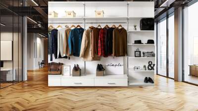 Modern wardrobe with stylish winter clothes and accessories Wall mural