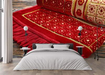 Muslim prayer rug on wooden background, closeup Wall mural