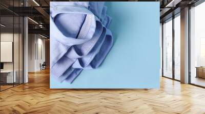 New male shirts on color background Wall mural