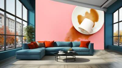 Overturned cup of coffee on color background Wall mural