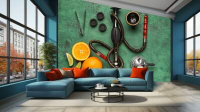 Parts of hookah and fruits on color background Wall mural