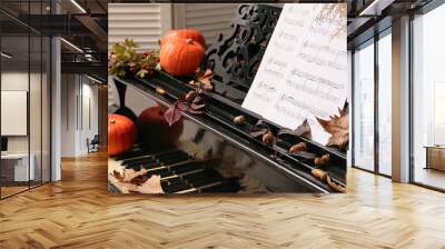 Piano decorated with pumpkins and autumn leaves. Closeup Wall mural