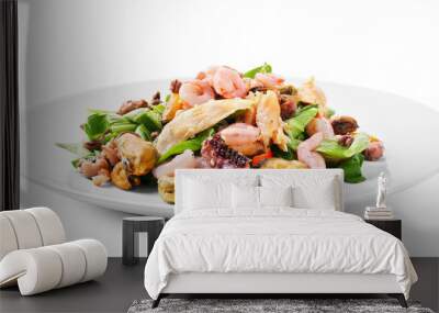 Plate of delicious vegetable salad with seafood on white background Wall mural