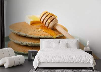 Plate of tasty pancakes with honey and butter on light background, closeup Wall mural