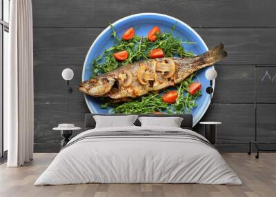 Plate with delicious sea bass fish, microgreens and tomatoes on dark wooden background Wall mural