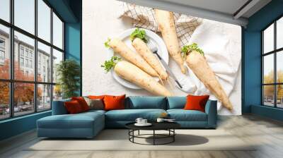 Plate with fresh daikon radishes on white background Wall mural