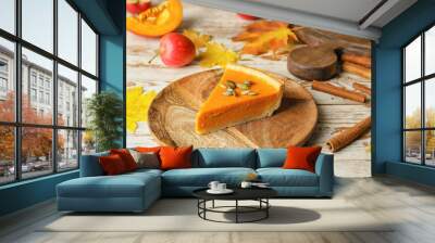 Plate with slice of tasty pumpkin pie on table Wall mural