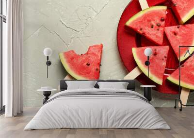 Plate with sweet watermelon sticks on grey background Wall mural