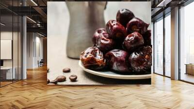 Plate with tasty dates on table, closeup Wall mural