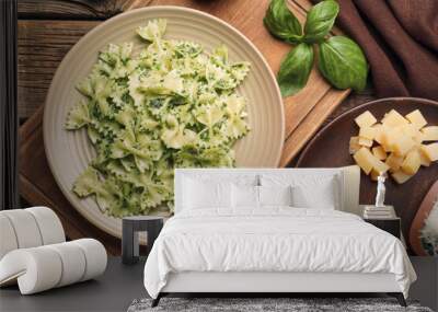 Plate with tasty pesto pasta on table Wall mural