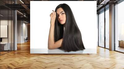 Portrait of beautiful young woman with healthy long hair on white background Wall mural