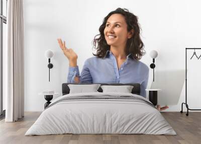 Portrait of businesswoman with laptop showing something on white background Wall mural