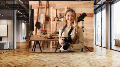 Portrait of female food photographer in home studio Wall mural