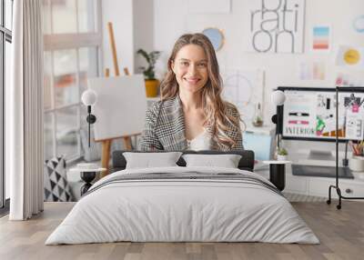 Portrait of female interior designer in office Wall mural