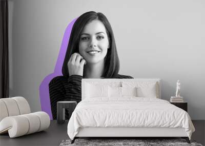 Portrait of happy young woman on grey background Wall mural