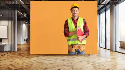 Portrait of male architect on color background Wall mural