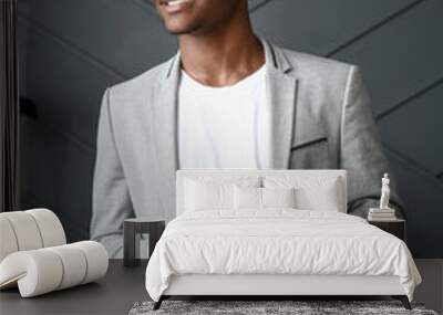 Portrait of stylish African-American man with mobile phone in room Wall mural