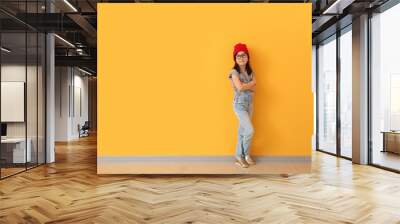 Portrait of stylish little girl near color wall Wall mural