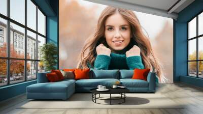 Portrait of stylish young woman on autumn day Wall mural