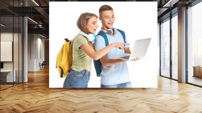 Portrait of young students with laptop on white background Wall mural