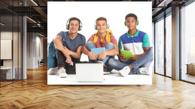 Portrait of young students with laptop on white background Wall mural