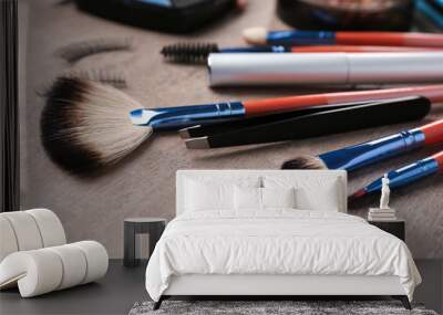 Professional makeup brushes on grey table Wall mural