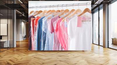 Rack with clothes in modern dry-cleaner's Wall mural