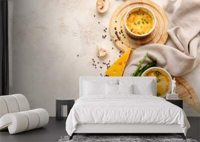 Ramekins with tasty julienne and ingredients on light background Wall mural