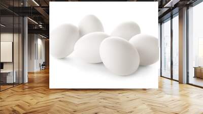 Raw chicken eggs on white background Wall mural