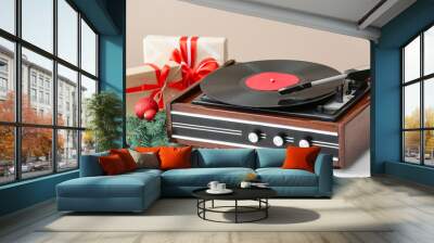 Record player and Christmas decor on table Wall mural