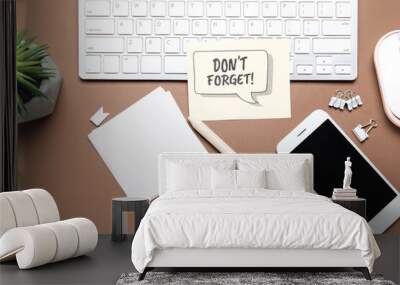 Reminder with stationery, mobile phone and computer keyboard on brown background Wall mural