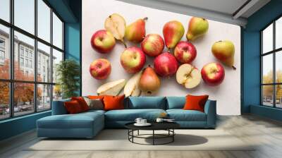 Ripe pears and apples on light background Wall mural