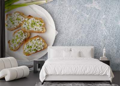 Sandwiches with tasty cottage cheese and green onion on grey background Wall mural