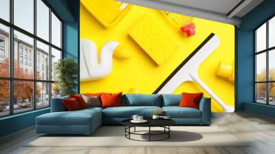 Set of cleaning supplies on color background Wall mural