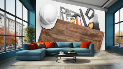 Set of construction tools and wooden board on white background Wall mural