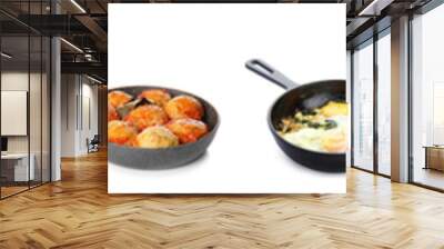 Set of frying pans with tasty cooked dishes on white background Wall mural