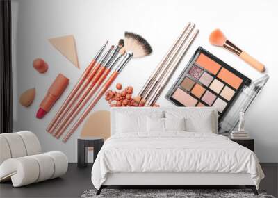 Set of makeup brushes with decorative cosmetics and sponges on white background Wall mural