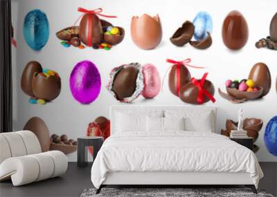 Set of sweet chocolate eggs and bunnies on white background Wall mural