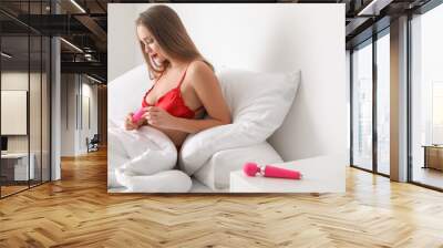 Sexy woman with vibrators in bedroom Wall mural