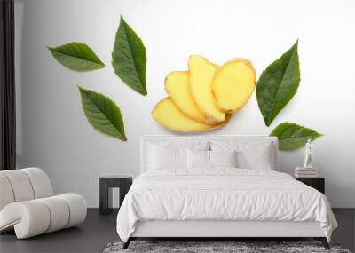 Slices of fresh ginger root and leaves on white background Wall mural