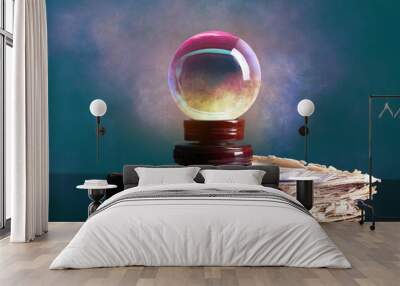 Spell book, crystal ball of fortune teller and cards on table Wall mural