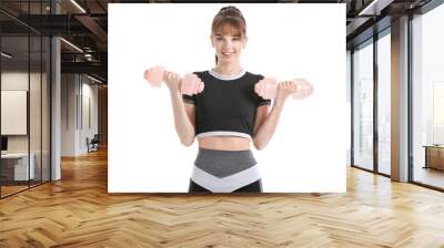 Sporty young woman with dumbbells on white background Wall mural