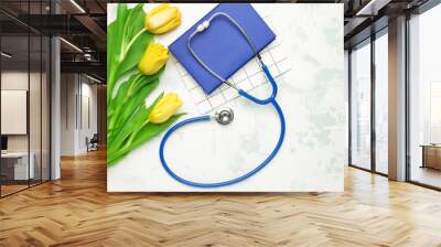 Stethoscope with flowers and notebooks on white background Wall mural