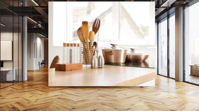 Stove with utensils on counter in kitchen Wall mural