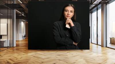 Stylish businesswoman with mobile phone on dark background Wall mural