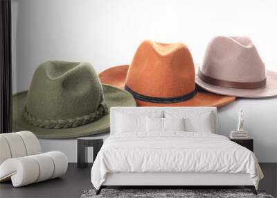 Stylish hats on white background Wall mural