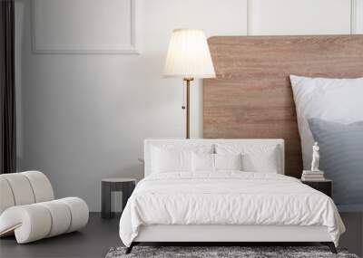 Stylish lamp on table in bedroom Wall mural